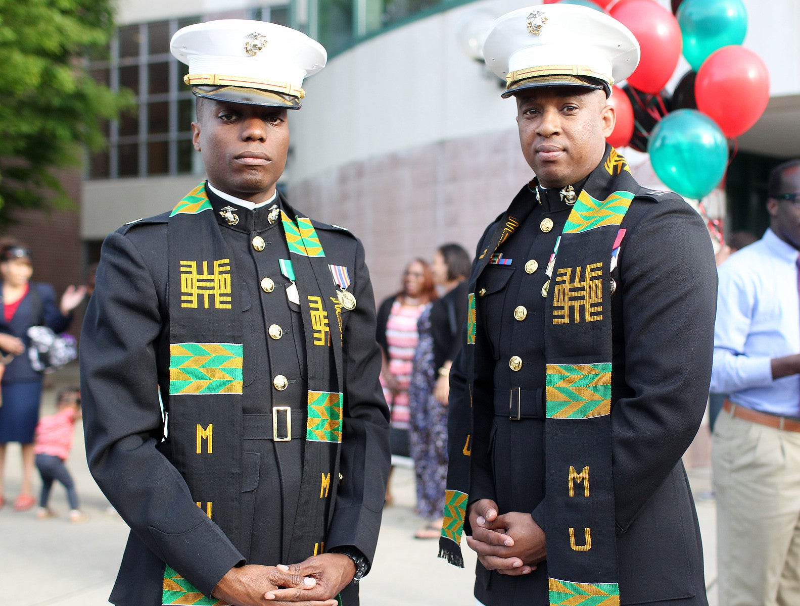 Sholten Singer/The Herald-Dispatch Capt. John Tucker, left, and Capt. Joseph Common receive their kentes as Marshall University's Center for African American Students hosts the annual Donning of Kente Celebration of Achievement on Thursday, May 2, 2013, at the Joan C. Edwards Playhouse in Huntington. 0503_kente_0