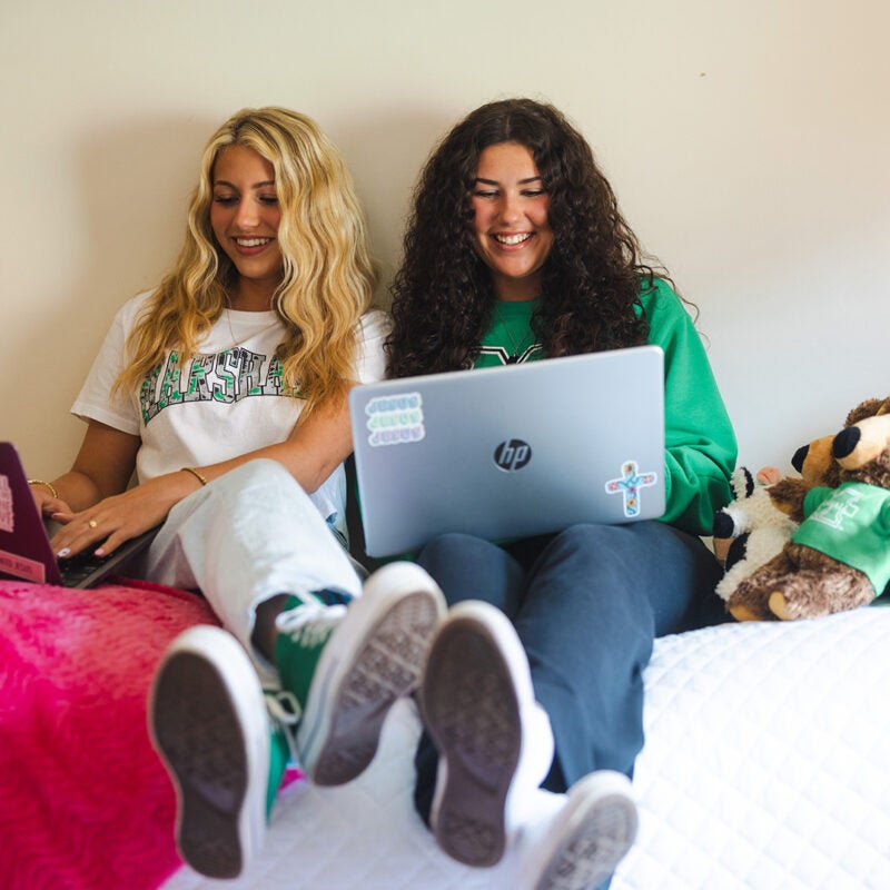 Two students study together in their residence hall room at Marshall University