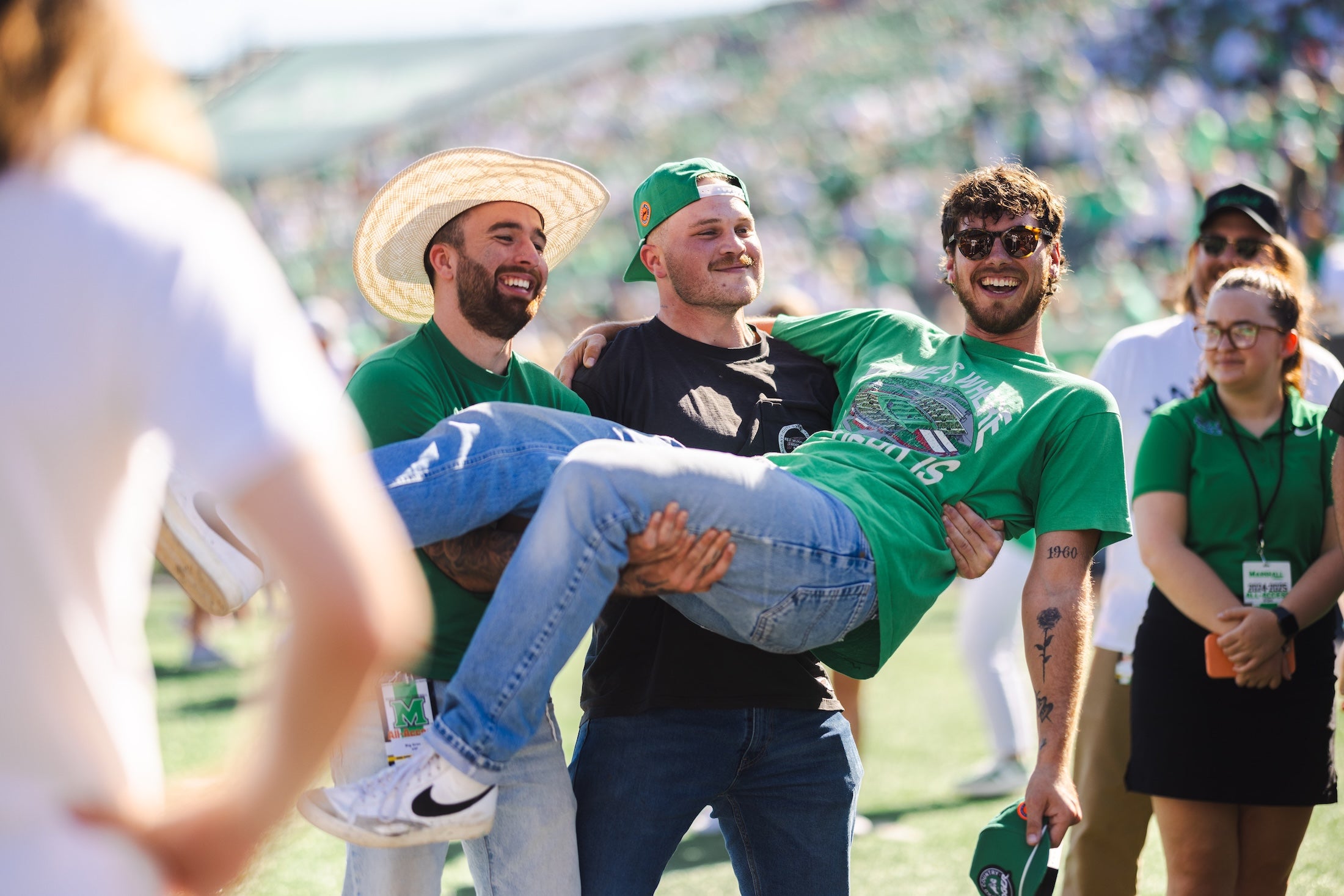 Zach Bryan and bandmates at a Marshall football game