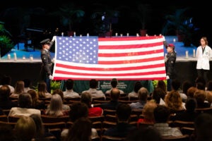 A flag is displayed at the memorial service in honor of the veteran donors