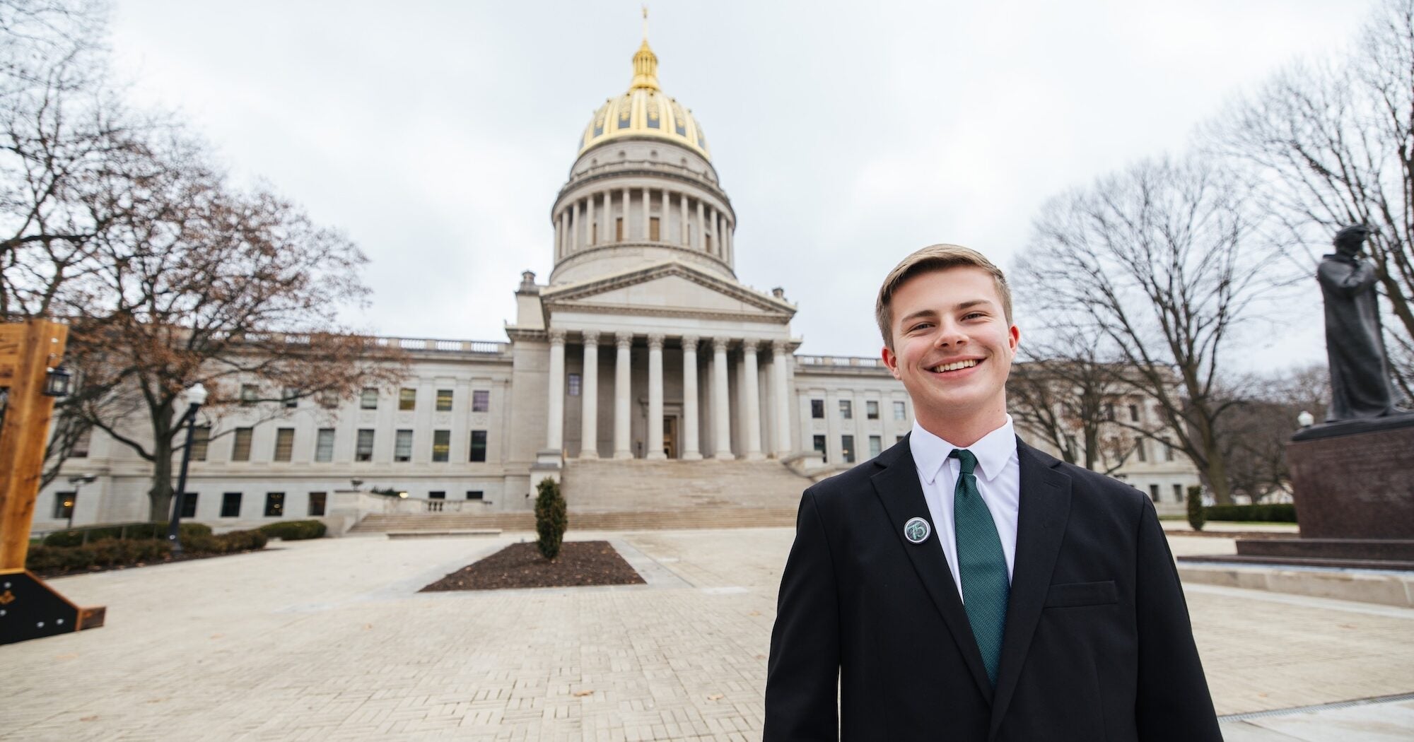 student standing outside the capitol building in Charleston