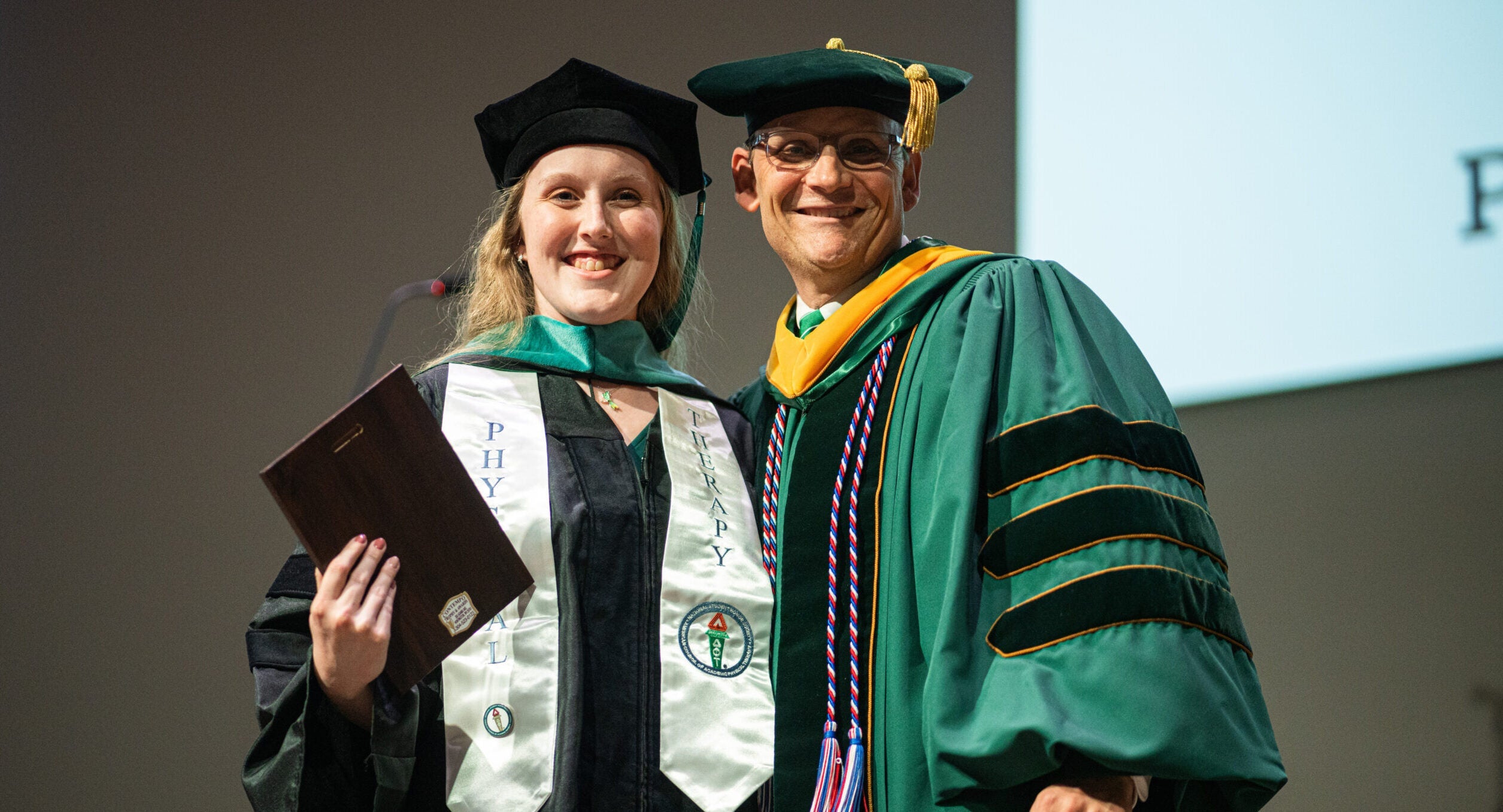 a PT graduate with a professor