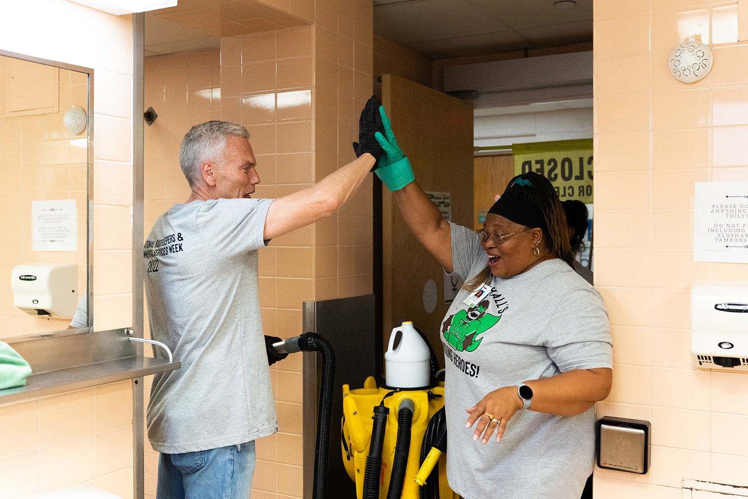 Brad D Smith gives employee a high five