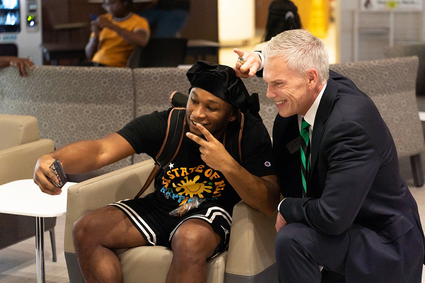 Brad D Smith with a Student in the Memorial Student Center