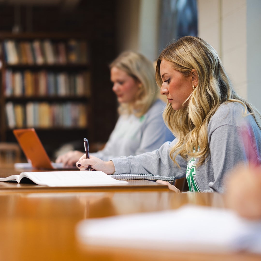Students study in a library setting at Marshall University