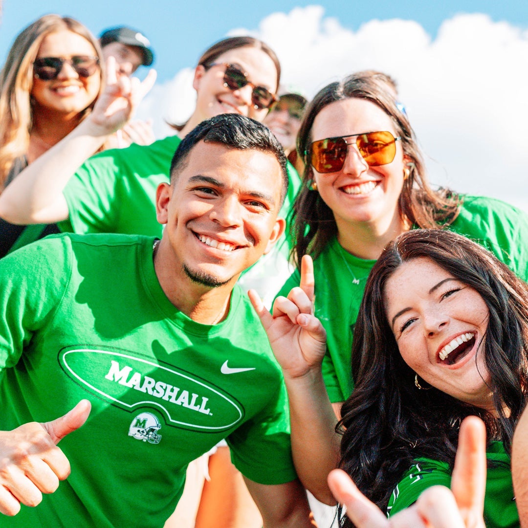 Marshall University Students cheering on the Thundering Herd
