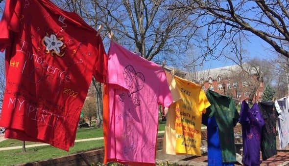 Image of seven t-shirts in a variety of colors for the clothesline project aimed at combating rape culture. 