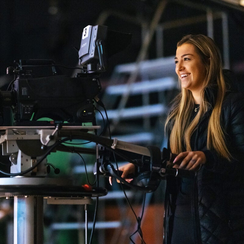 A student operates a camera in the TV Studio at Marshall University