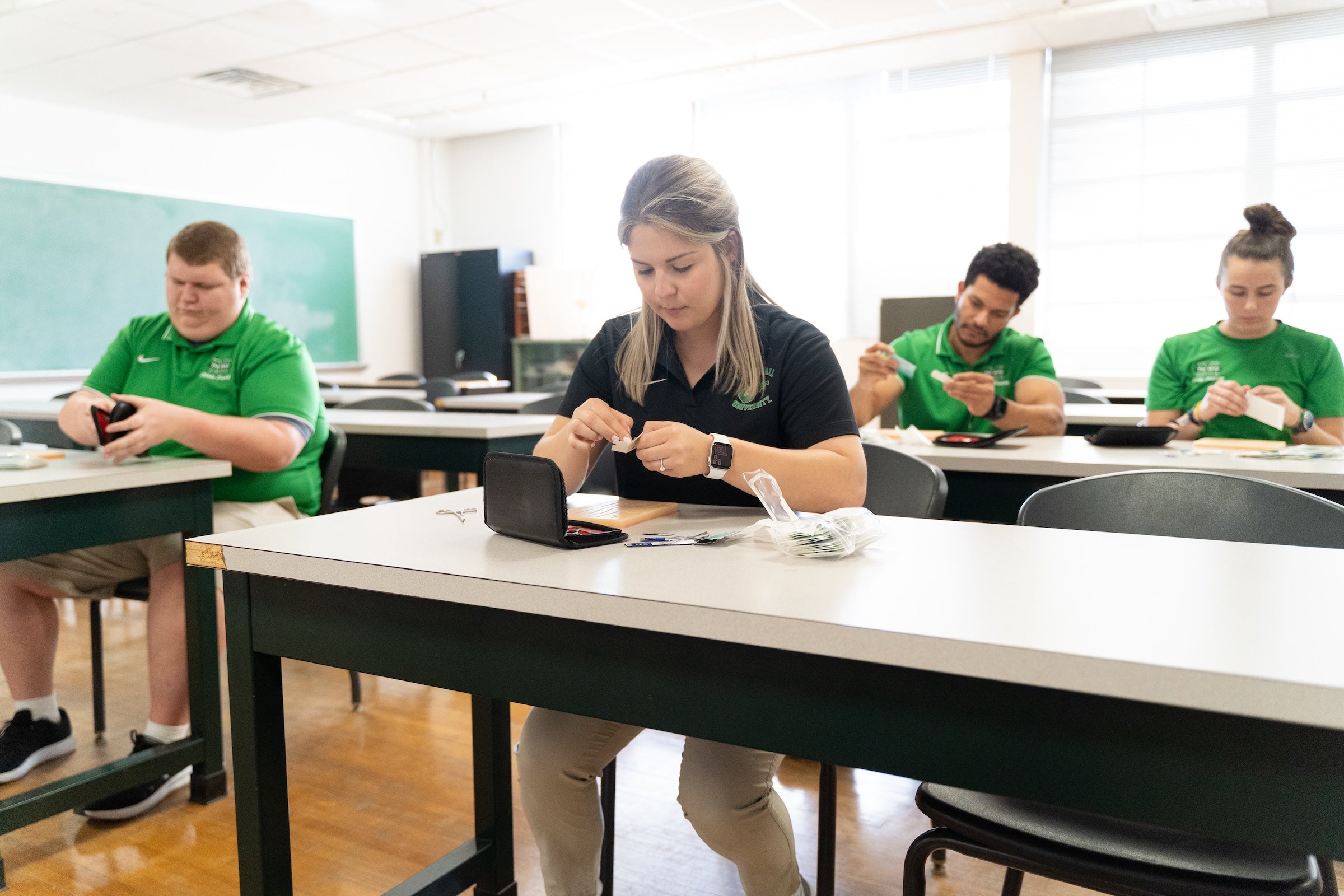 students working at lab tables in an exercise science lab