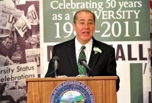 Acting Governor Earl Ray Tomblin reads the proclamation making March 2, 2011, "Marshall University Day."