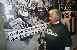 Mary Hanna Dooley, class of 1961, with a photo of herself when the news was announced on campus.