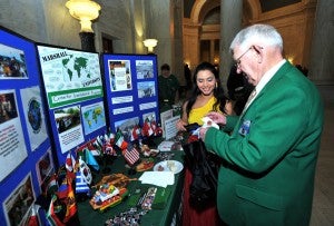 A Marshall international student visits with a member of the House of Delegates.