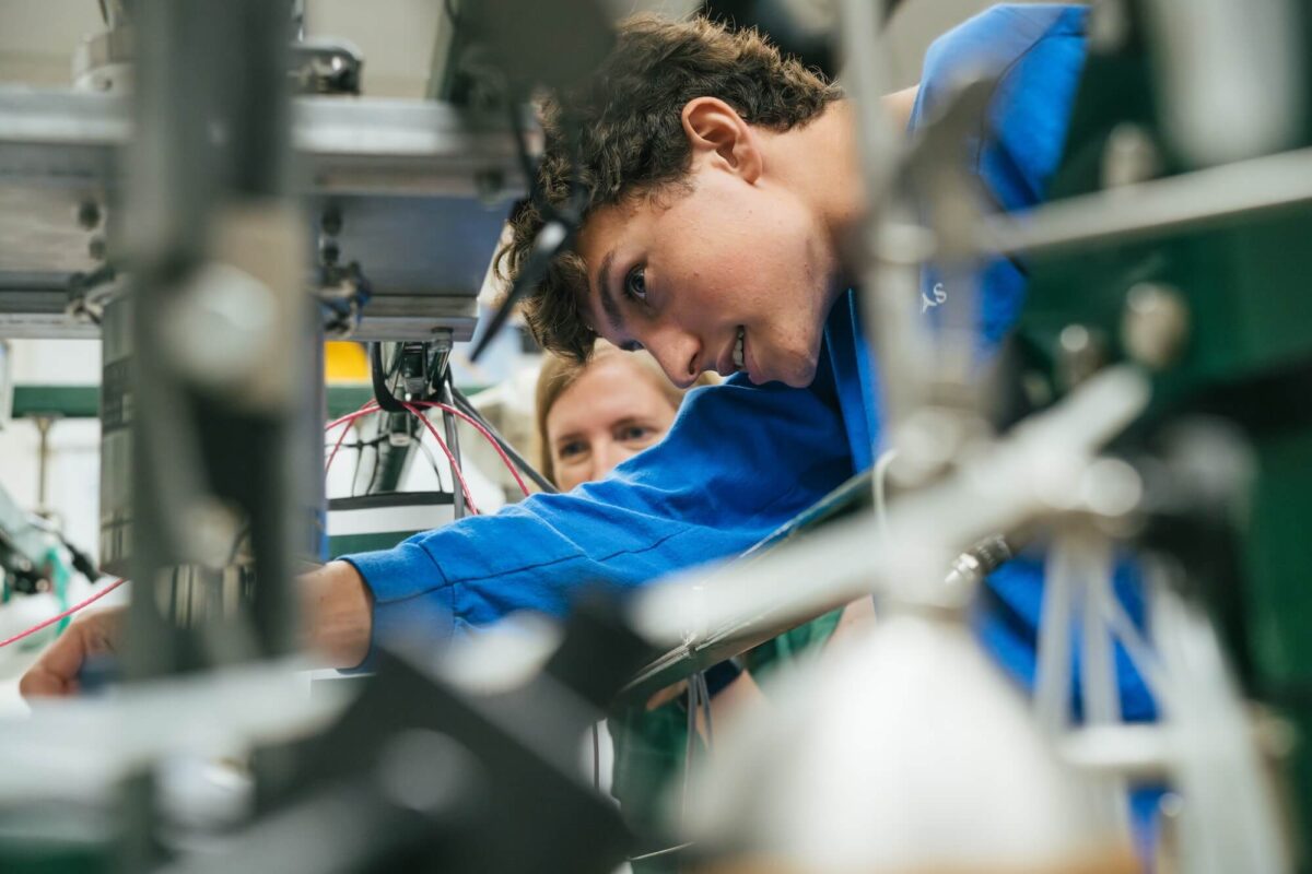student and a professor working in a lab