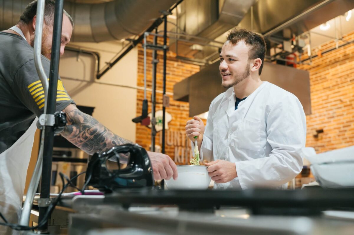 two students working in a cooking lab