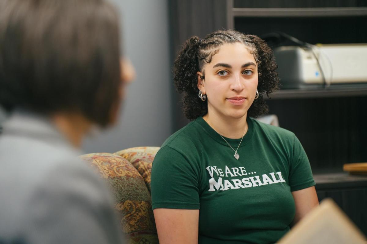 student listening intently to professor during class