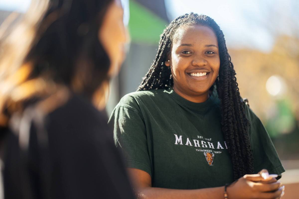two students talking outside the Memorial Student Center on campus