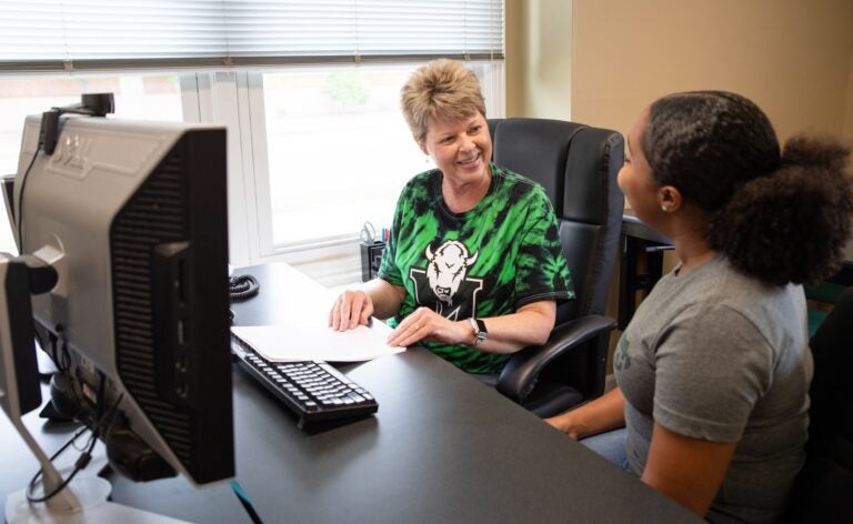 student working with an advisor at the Office of Career Education