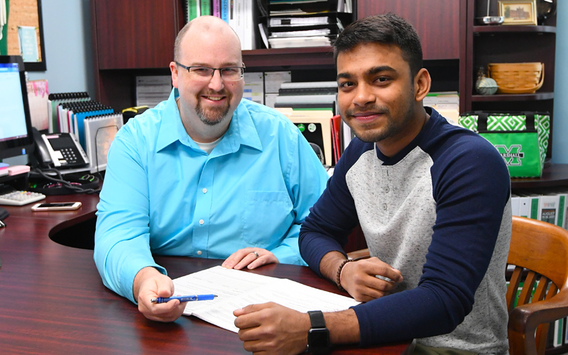 A student meets with an academic advisor
