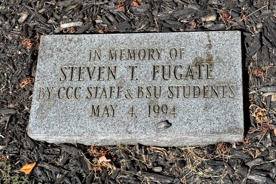 Stone memorial marker at the base of the Steven T. Fugate Memorial Tree inscribed, βIn Memory of Steven T. Fugate by CCC Staff & BSU Students, May 4, 1994.β