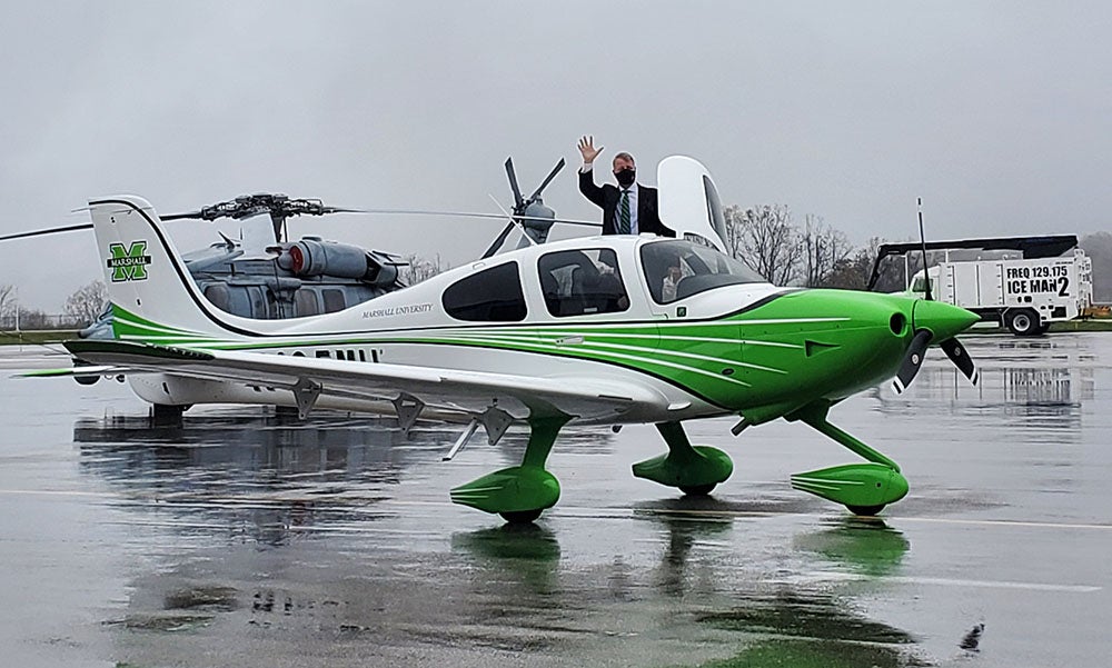 Bill Noe waving from Marshall plane