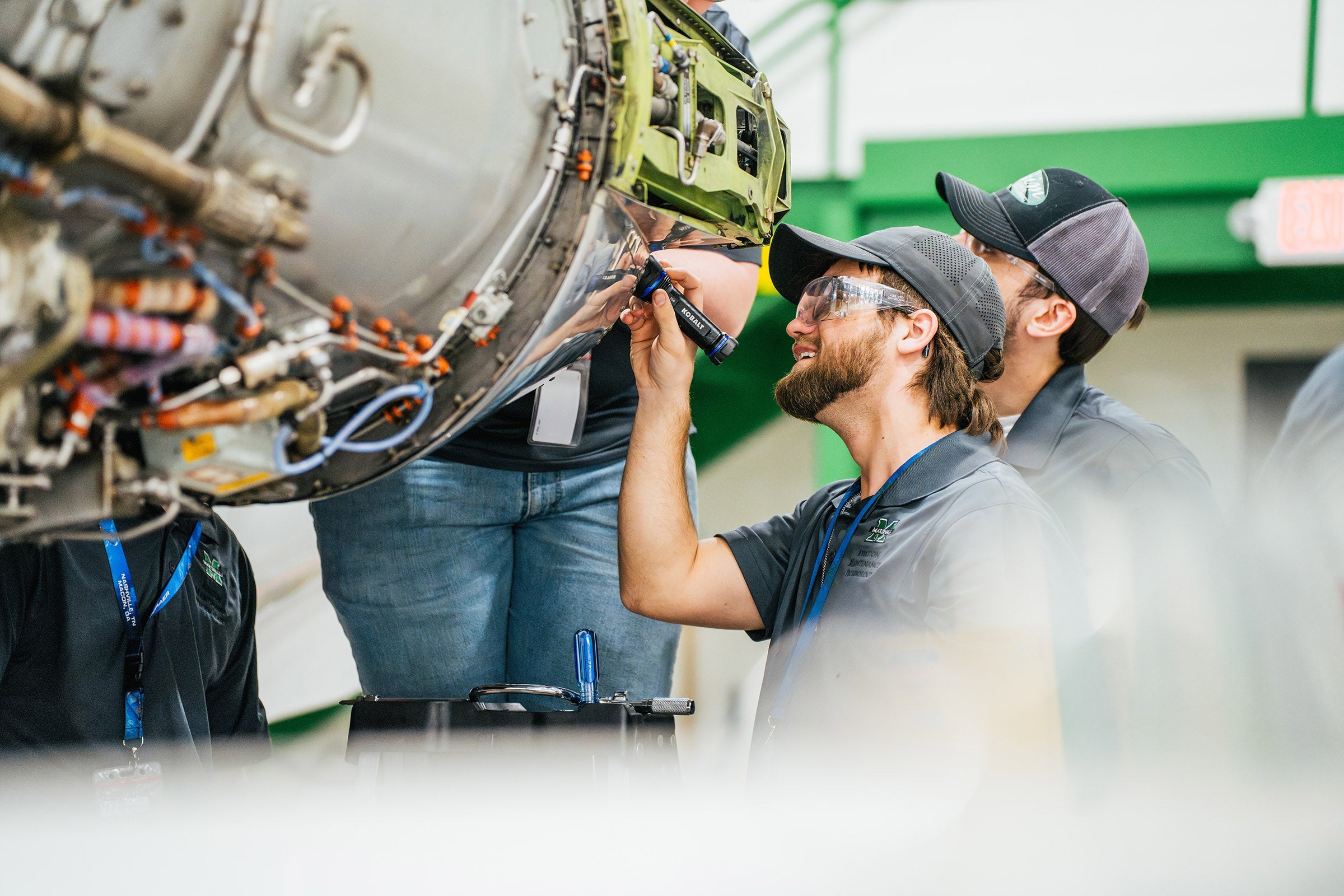 Marshall University Aviation Maintenance Technology students work on an aircraft