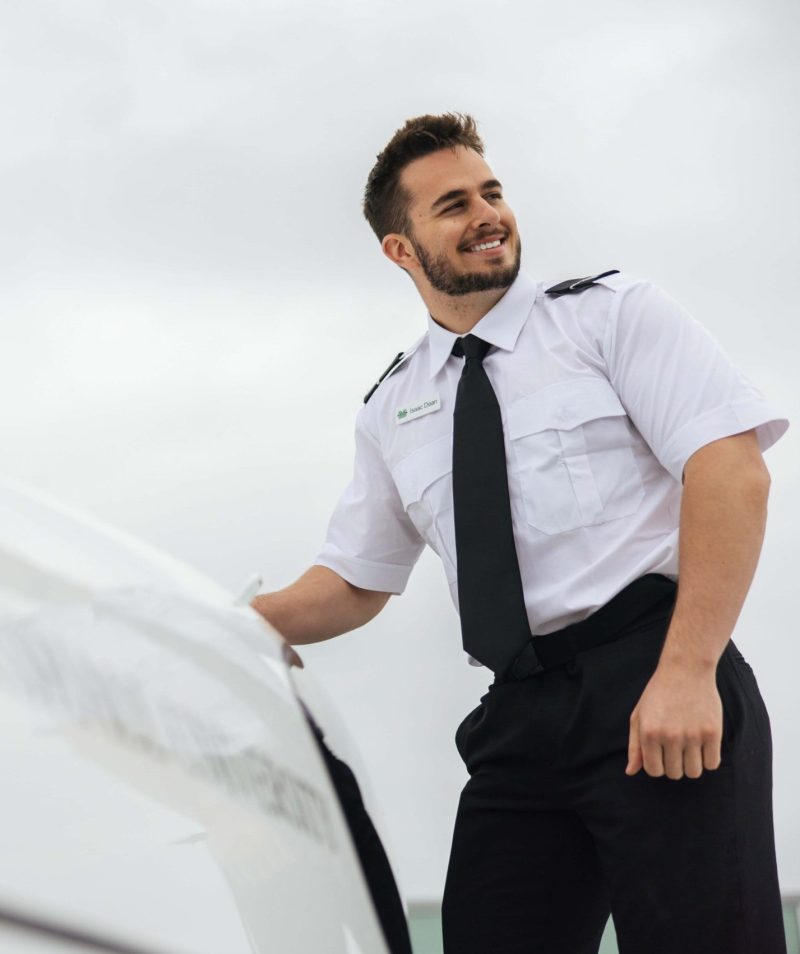 A flight student enters a plane.