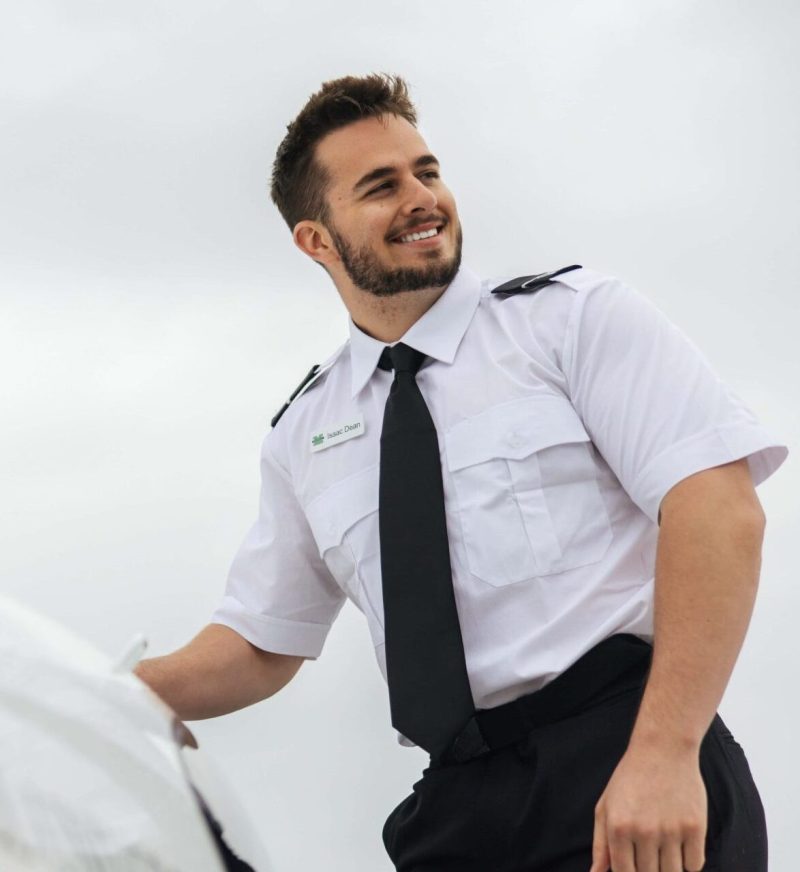 A flight student enters a plane.