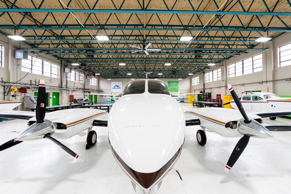 An airplane sits in the hangar with Marshall Aviation and Mountwest CTC banners hanging in the background at Huntington Tri-State Airport
