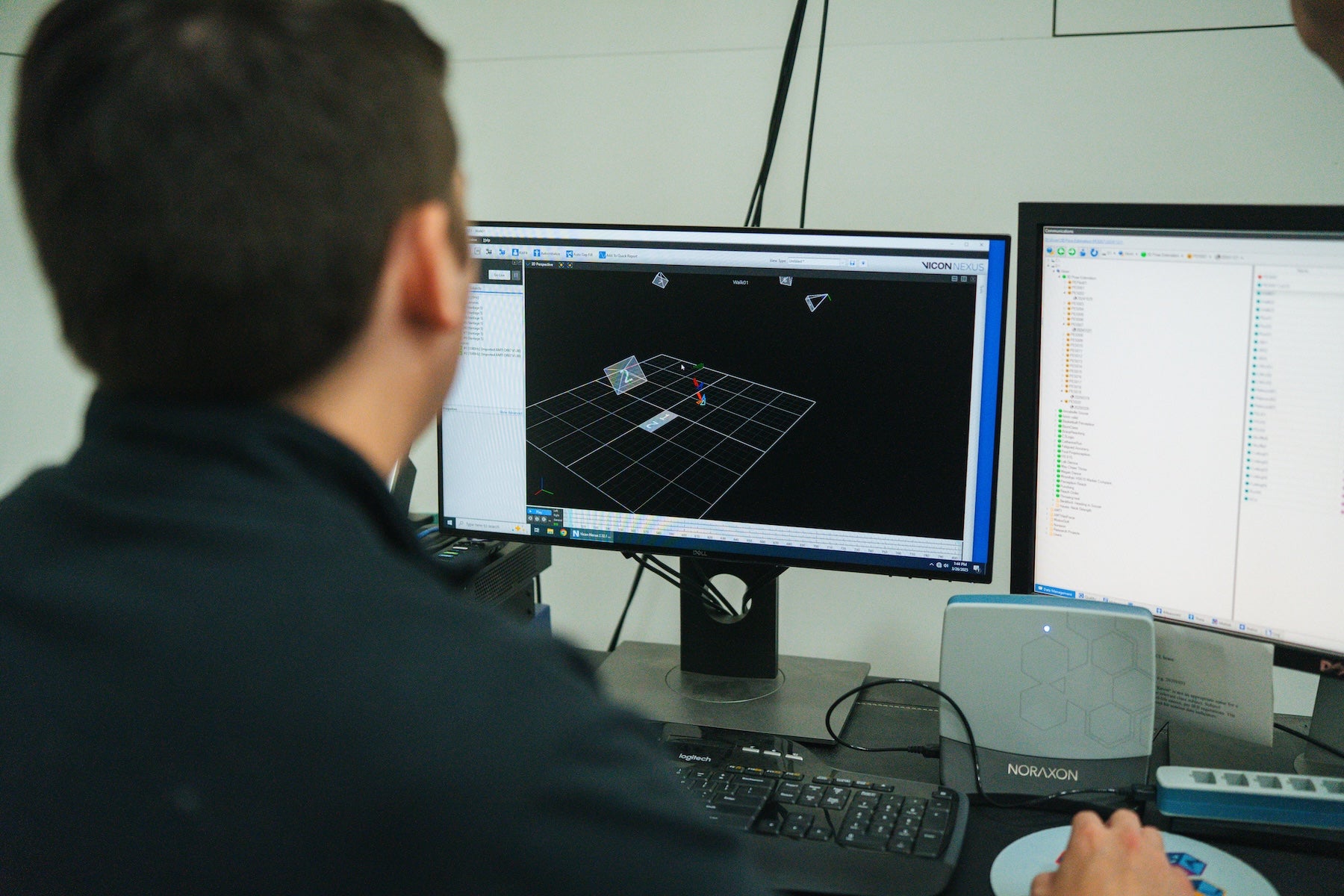 student working on a desktop computer in the biomechanics-dev lab