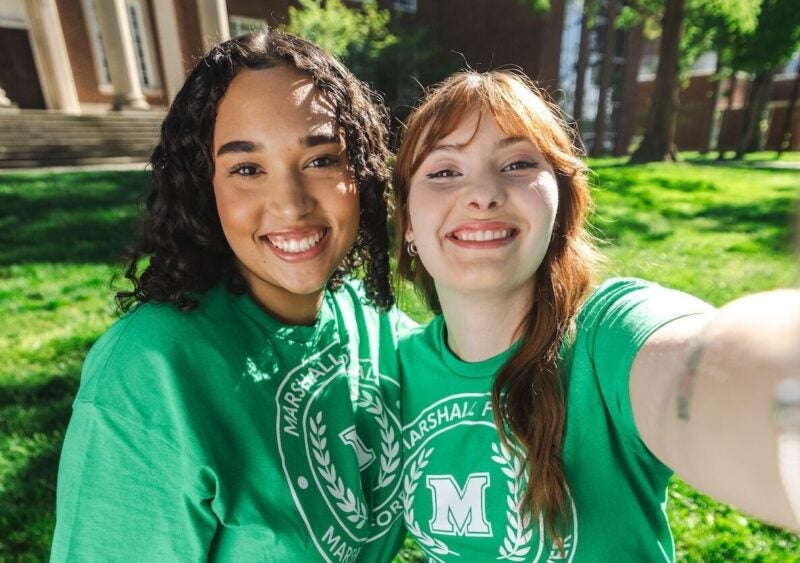 two Marshall for All students smiling on campus