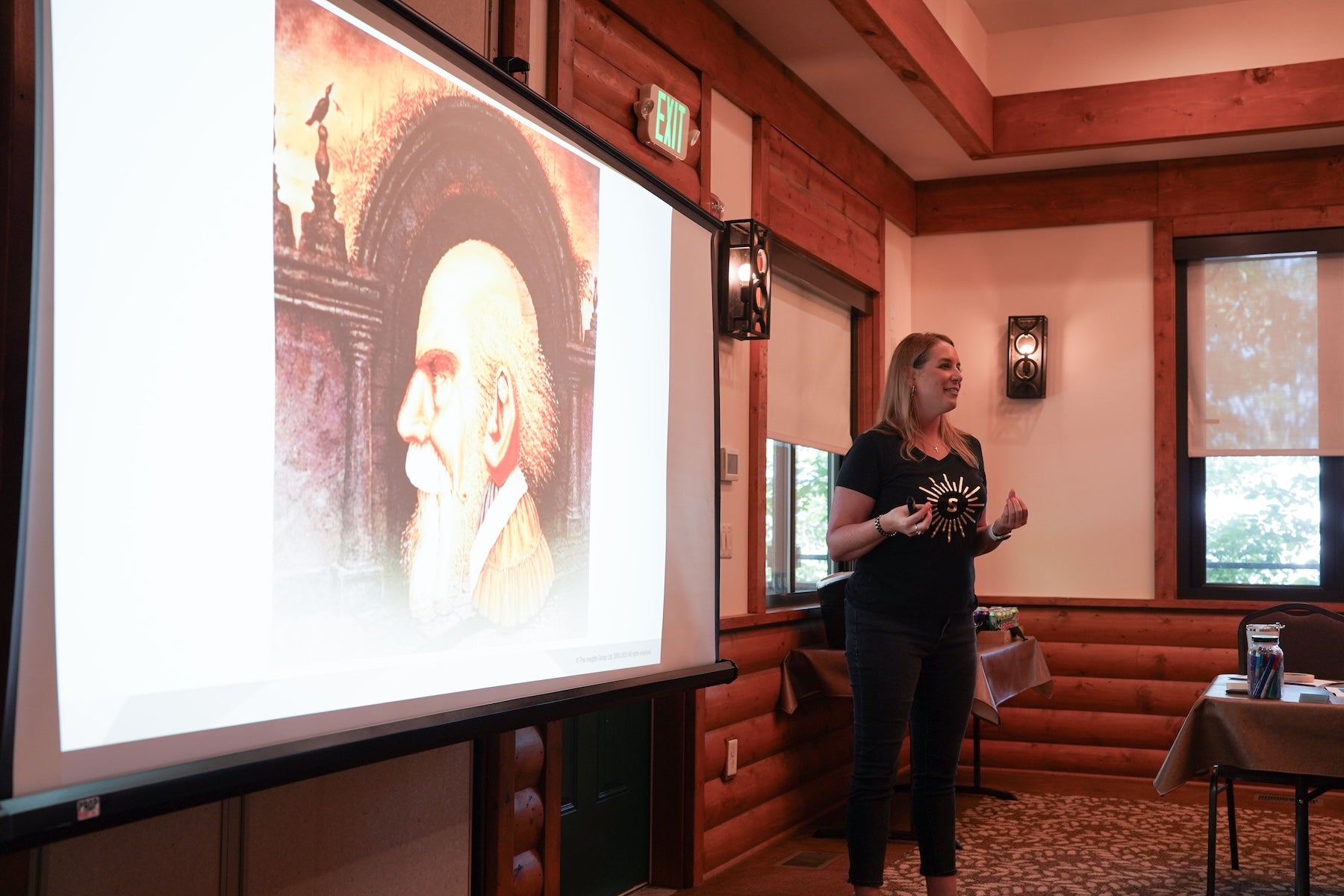 person leading a personality workshop with a powerpoint screen