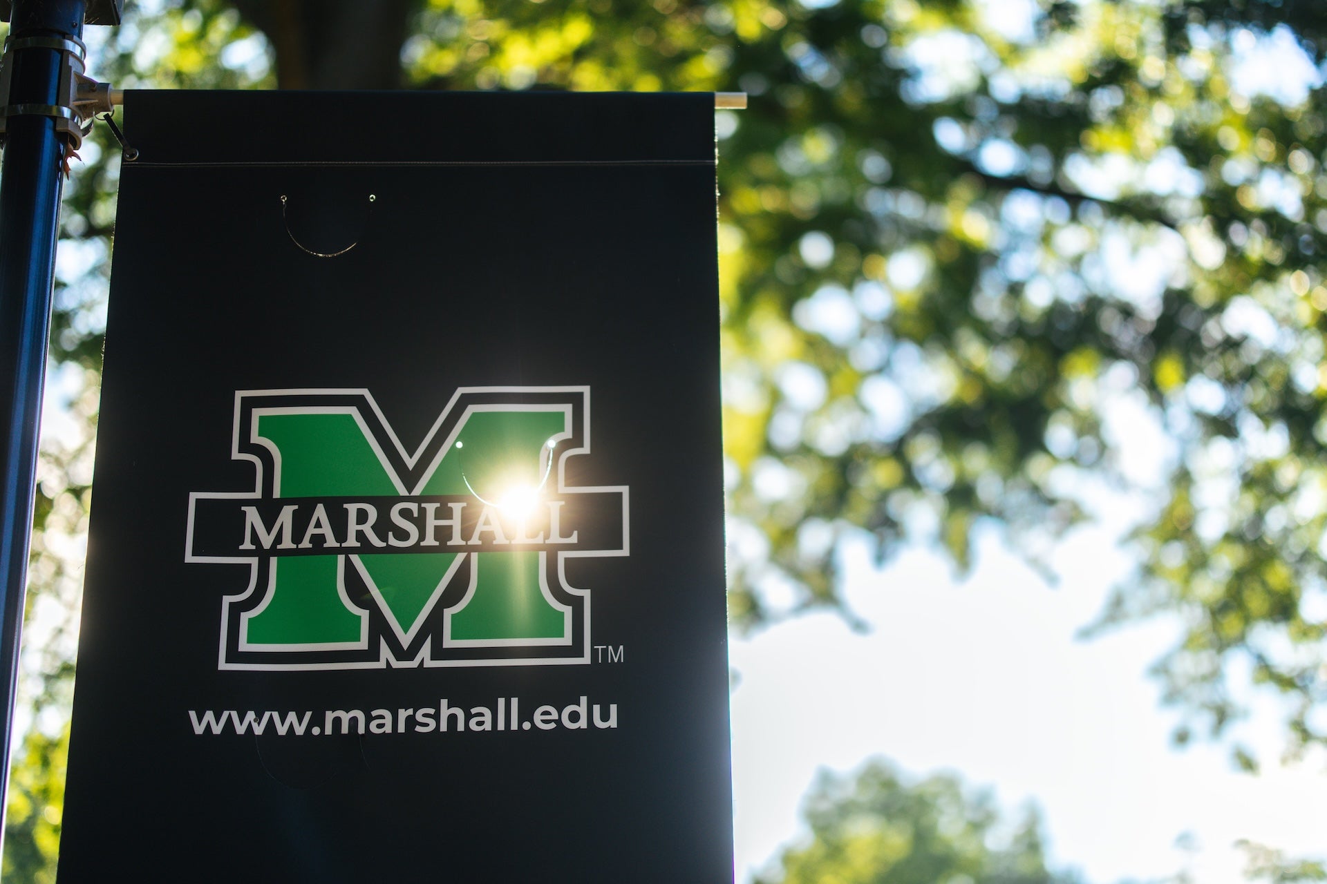 Image of Marshall flag with sun shining through it.