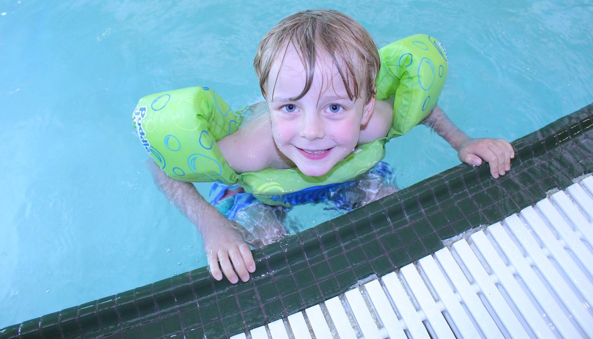 Image of young male in rec pool