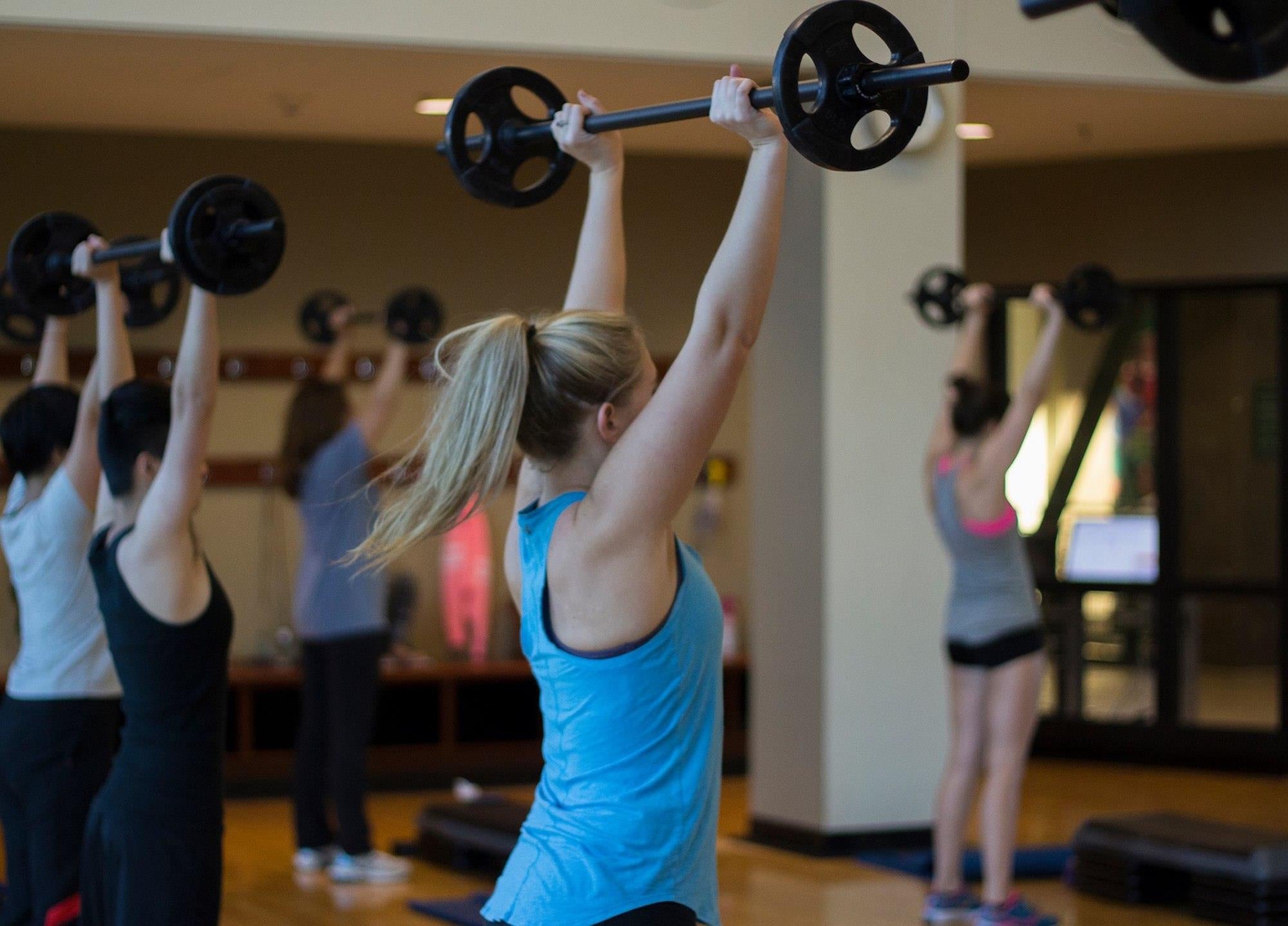 Image of Fitness class, female with weights