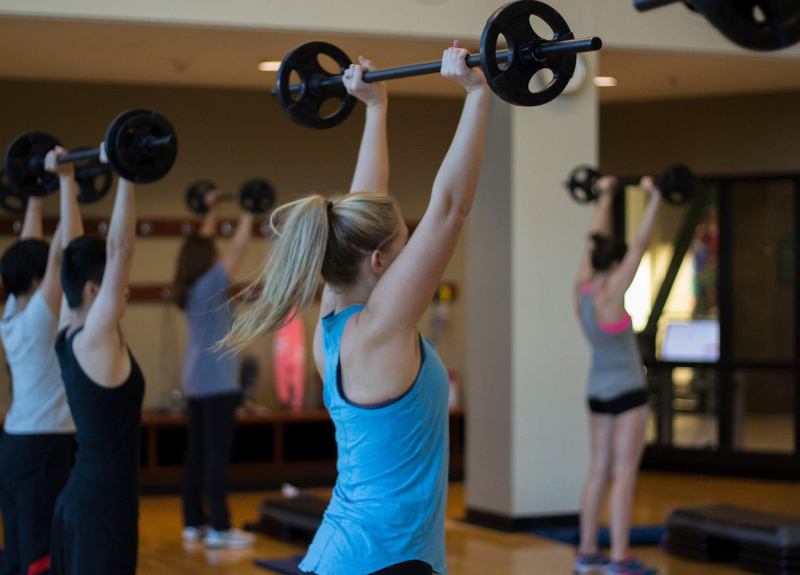 Image of Fitness class, female with weights
