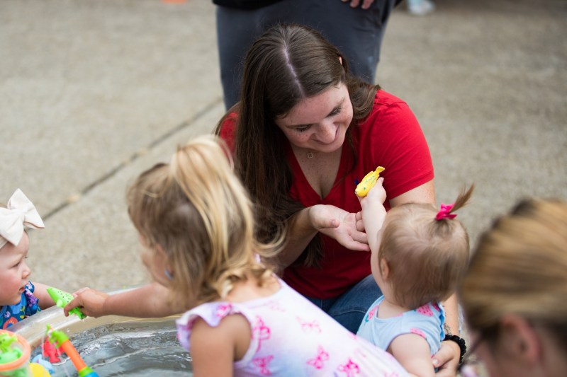 family interacting at a community carnival