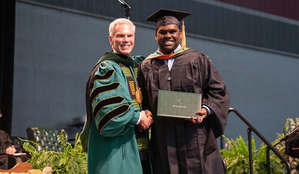 President Brad D. Smith with graduate