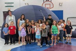 Students at Guyandotte Elementary get a glimpse of the stars courtesy of Physics' portable planetarium
