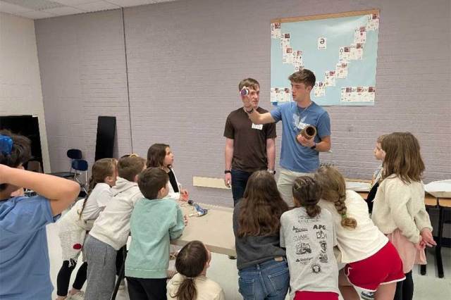 Biology students engage young learners during Mad Scientist Day