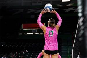 CFS student Bella Thompson setting in a volleyball match for the Thundering Herd