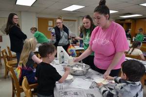 COS volunteers guide families through hands-on science at Family Science Fun Day