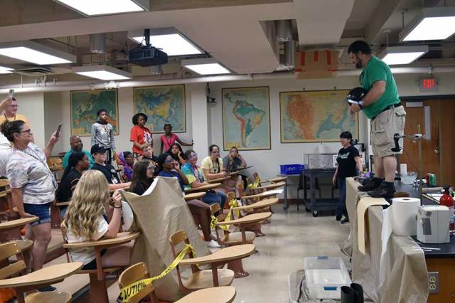 Physics faculty share excitement of science with HSTA students