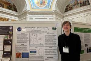 Physics student Tyler Parsons stands with his research poster in the WV Capitol rotunda during Research Day at the Capitol