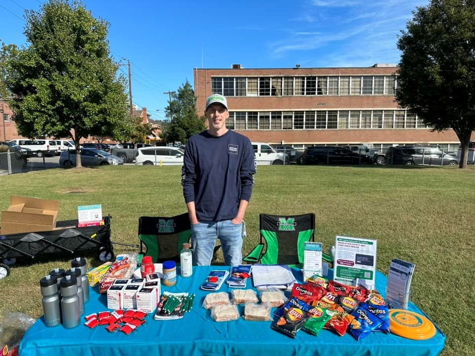 Photo of a table setup with snacks and giveaways
