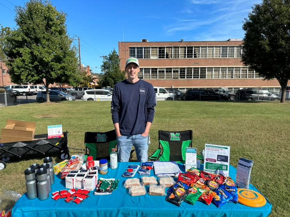 Photo of a table setup with snacks and giveaways