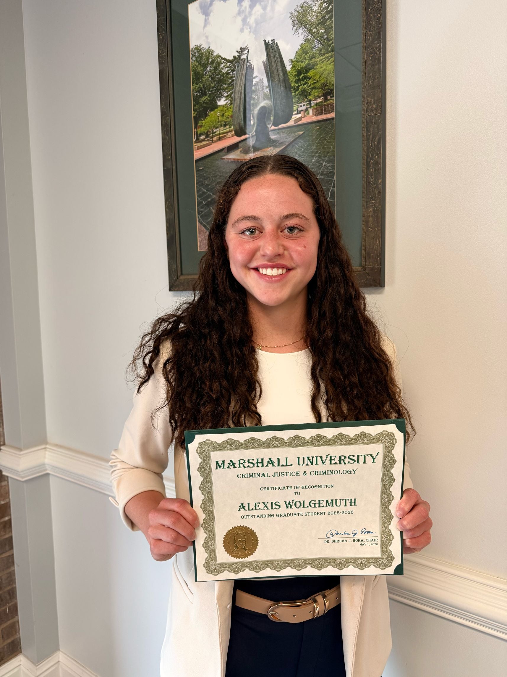 Alexis Wolgemuth with a certificate