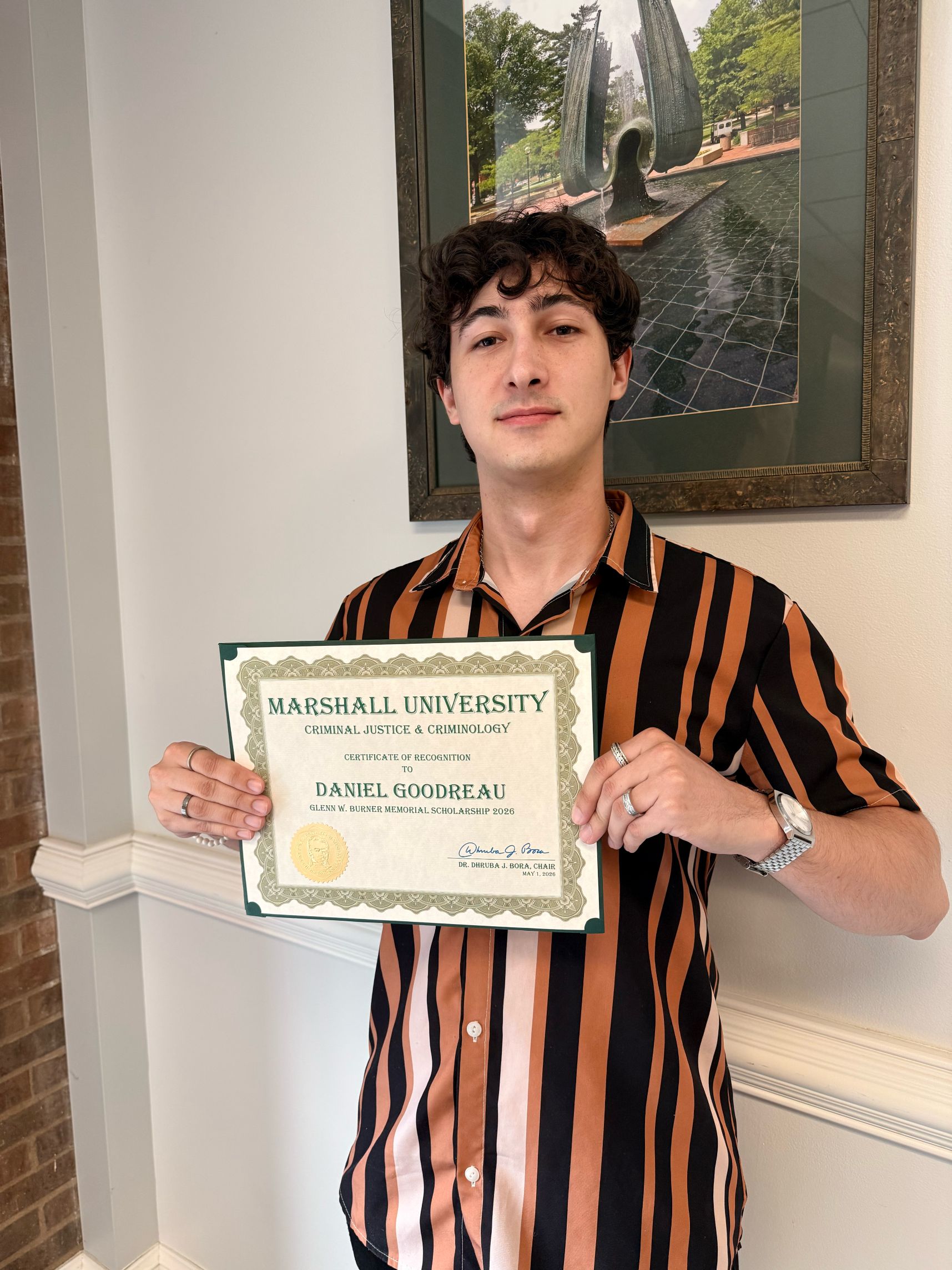 Daniel Goodreau with a certificate