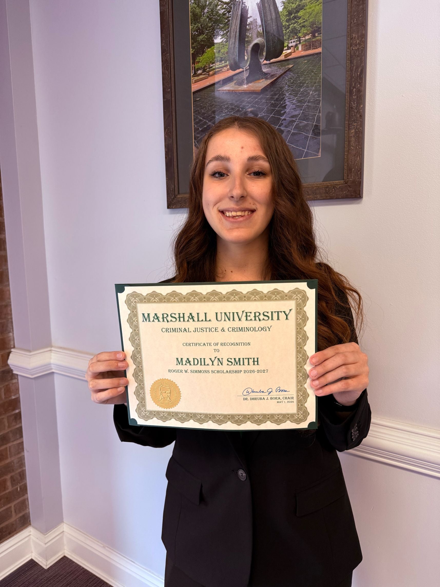 Madilyn Smith holding a certificate