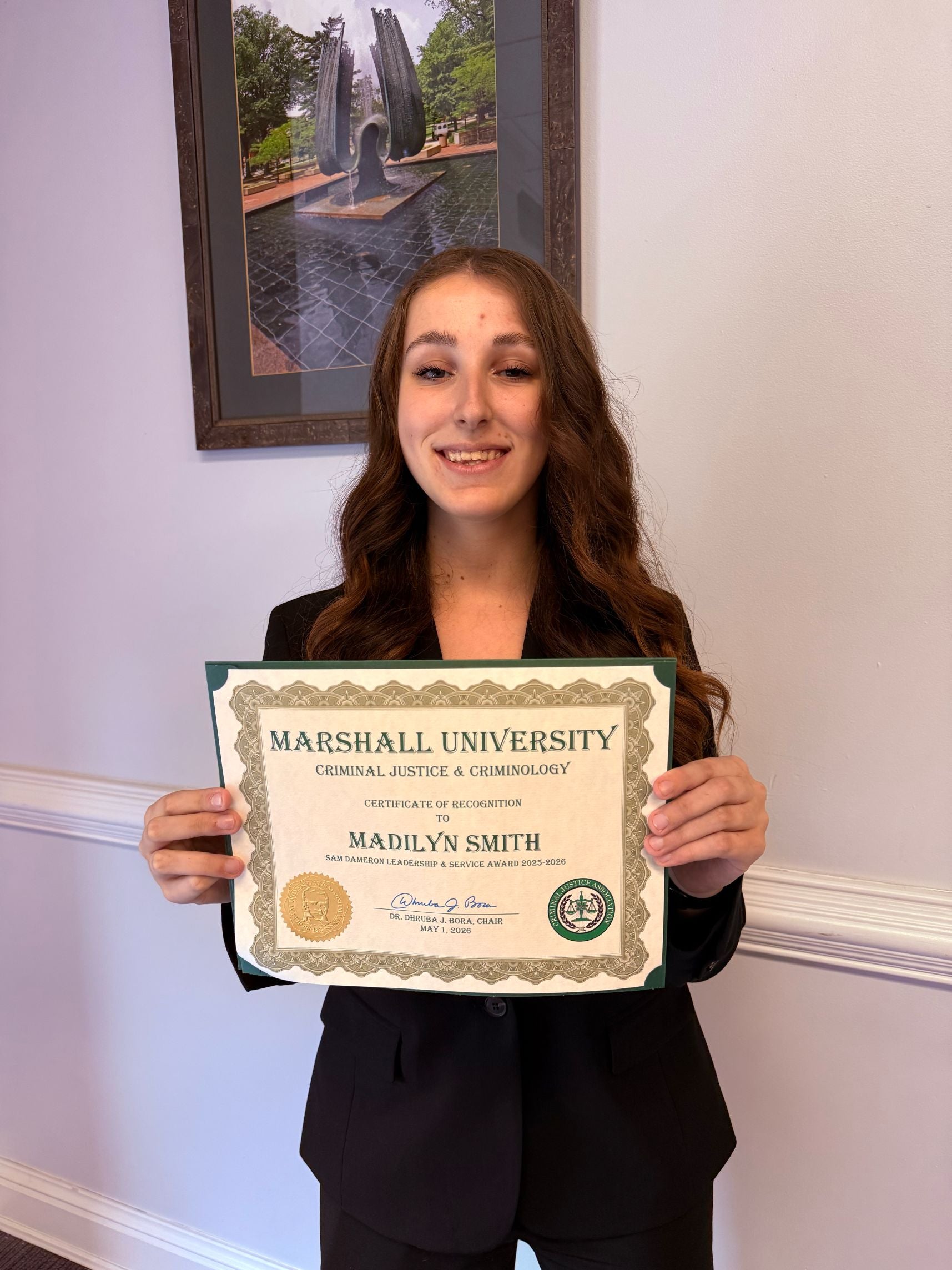 Madilyn Smith with a certificate