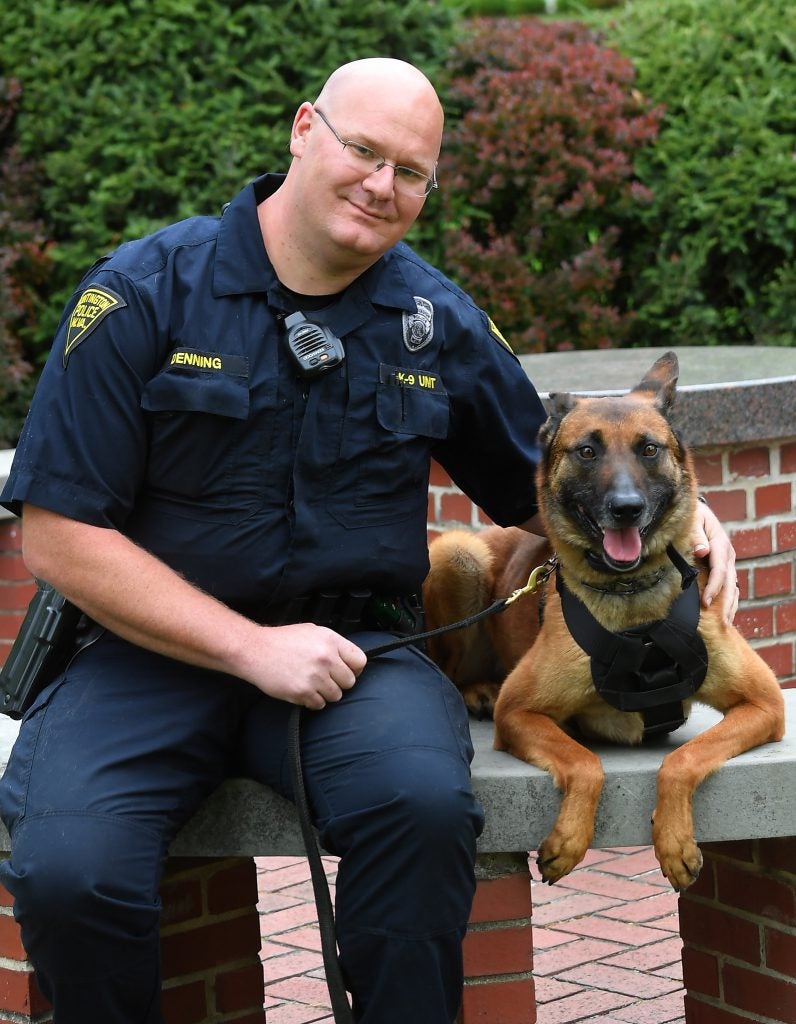 Portrait of Officer Joe Denning with his K-9 teammate